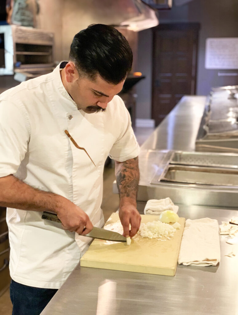 Chef Alan Molina working his knife skills in the kitchen